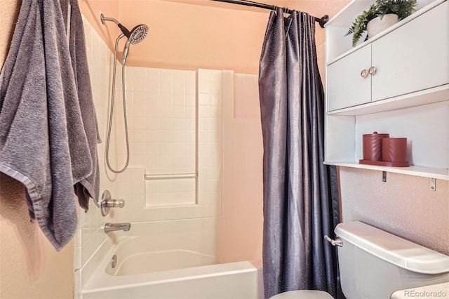 bathroom featuring toilet and shower / bath combination with curtain