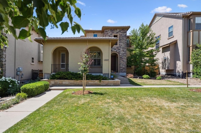 10205 Bluffmont Dr, Lone Tree, CO 80124 - mediterranean / spanish house featuring stucco siding, a front yard, and a tiled roof