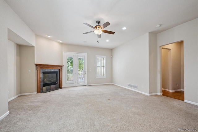10205 Bluffmont Dr, Lone Tree, CO 80124 - unfurnished living room featuring carpet flooring, a fireplace, ceiling fan, and recessed lighting