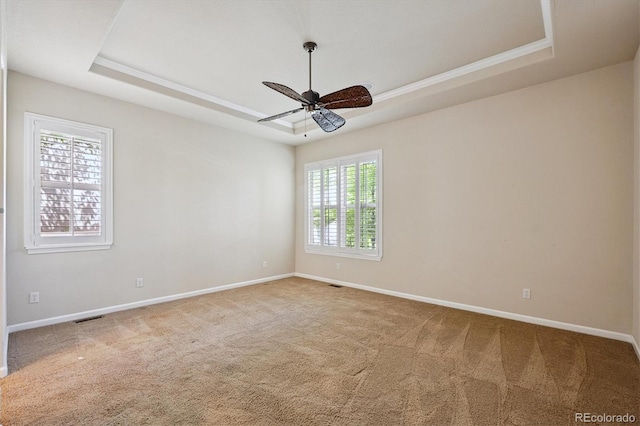 10205 Bluffmont Dr, Lone Tree, CO 80124 - carpeted spare room featuring a tray ceiling and ceiling fan