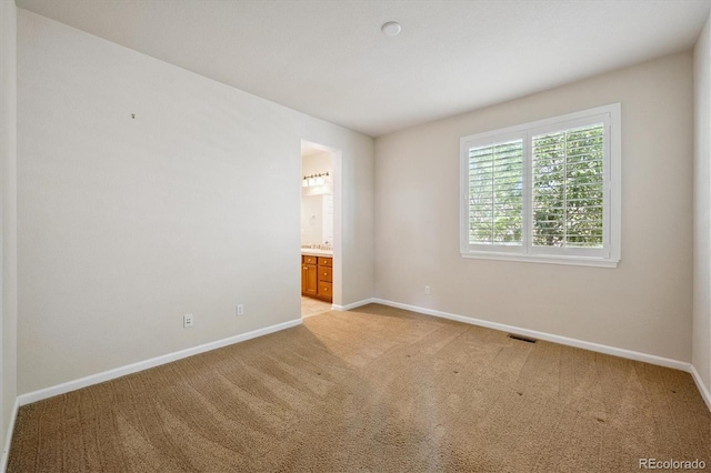 10205 Bluffmont Dr, Lone Tree, CO 80124 - spare room featuring baseboards and light carpet
