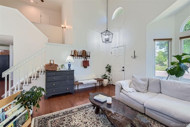 728 Poppywood Pl, Highlands Ranch, CO 80126 - living area with a high ceiling, stairway, and wood finished floors