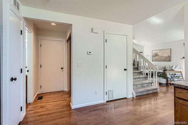 728 Poppywood Pl, Highlands Ranch, CO 80126 - hallway with light wood-style floors, stairway, and baseboards