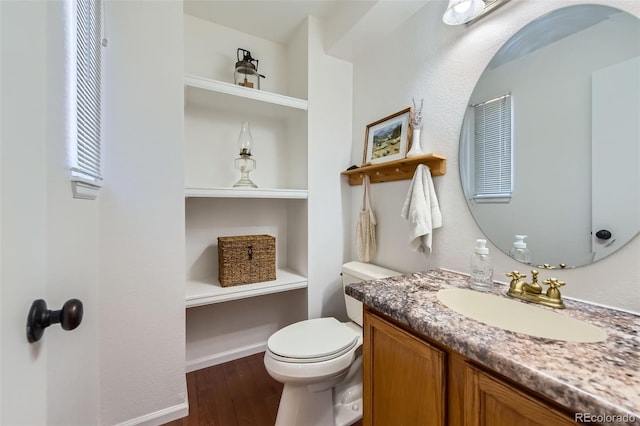 728 Poppywood Pl, Highlands Ranch, CO 80126 - bathroom with wood finished floors, vanity, and toilet