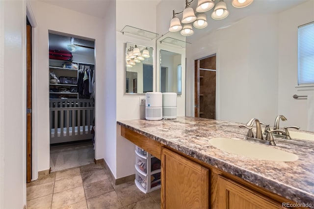728 Poppywood Pl, Highlands Ranch, CO 80126 - full bath with vanity, a walk in closet, a shower, and baseboards