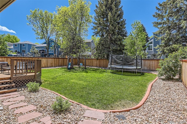 728 Poppywood Pl, Highlands Ranch, CO 80126 - view of yard with a trampoline, a wooden deck, and a residential view