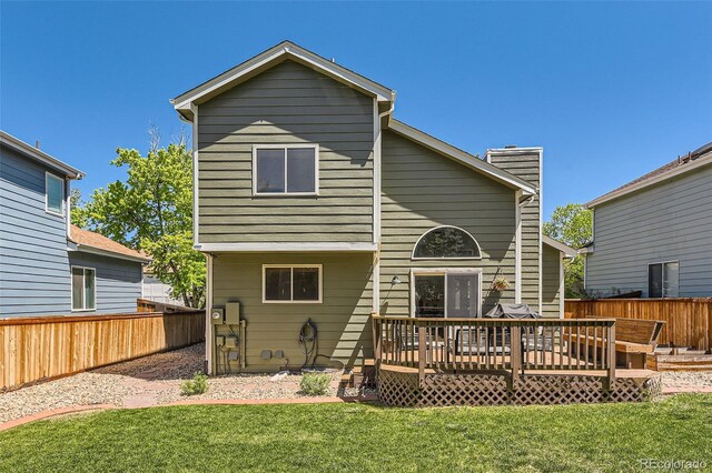 728 Poppywood Pl, Highlands Ranch, CO 80126 - back of house with a wooden deck and a chimney