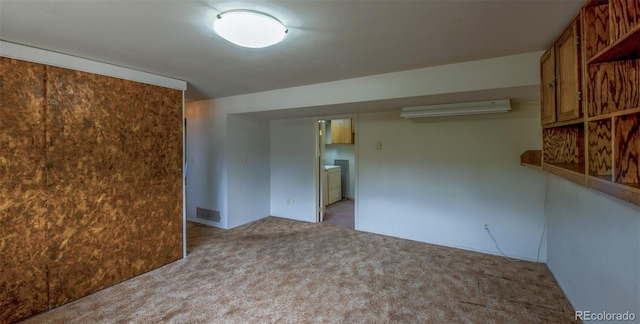 carpeted empty room featuring visible vents