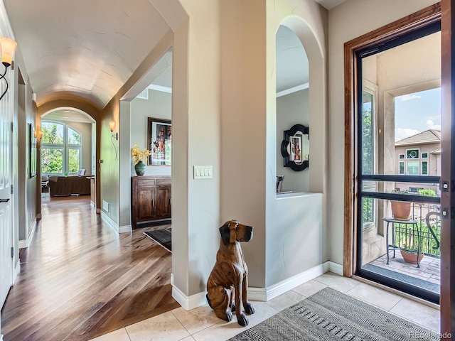 5092 S Allison Way, Littleton, CO 80123 - entryway featuring arched walkways, lofted ceiling, and light wood-style flooring