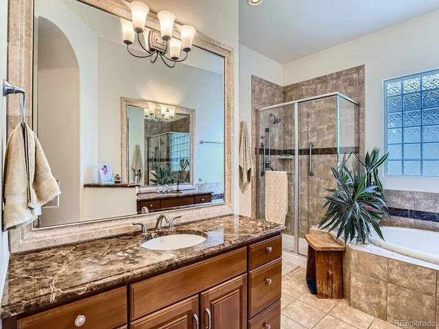 5092 S Allison Way, Littleton, CO 80123 - full bath with a chandelier, a stall shower, vanity, a bath, and tile patterned flooring