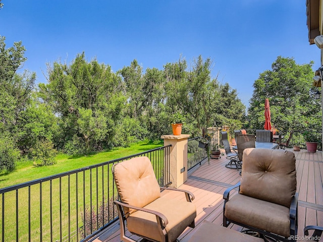 5092 S Allison Way, Littleton, CO 80123 - wooden terrace featuring a lawn and outdoor dining space
