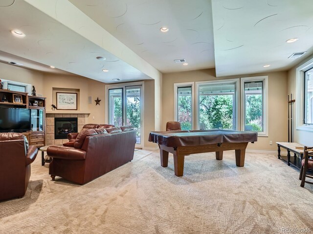 5092 S Allison Way, Littleton, CO 80123 - rec room with light colored carpet, plenty of natural light, a tiled fireplace, pool table, and recessed lighting