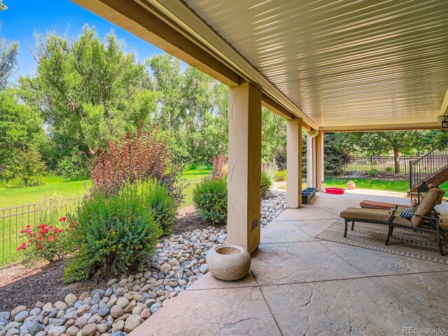 5092 S Allison Way, Littleton, CO 80123 - fenced backyard with a patio area