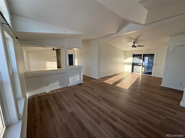 unfurnished living room featuring lofted ceiling, dark wood-type flooring, and ceiling fan