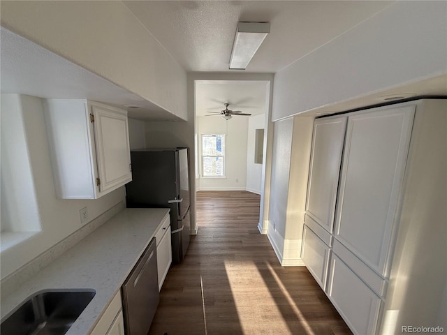 kitchen with sink, ceiling fan, appliances with stainless steel finishes, dark hardwood / wood-style floors, and white cabinets