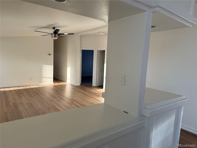 interior space featuring hardwood / wood-style flooring and ceiling fan