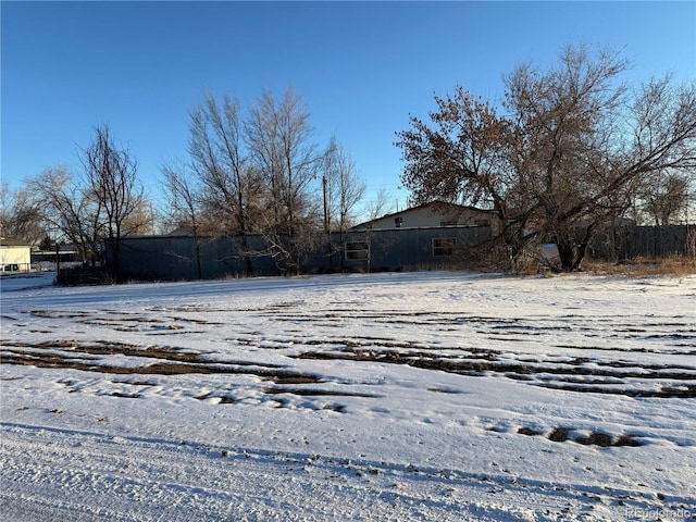 view of yard layered in snow