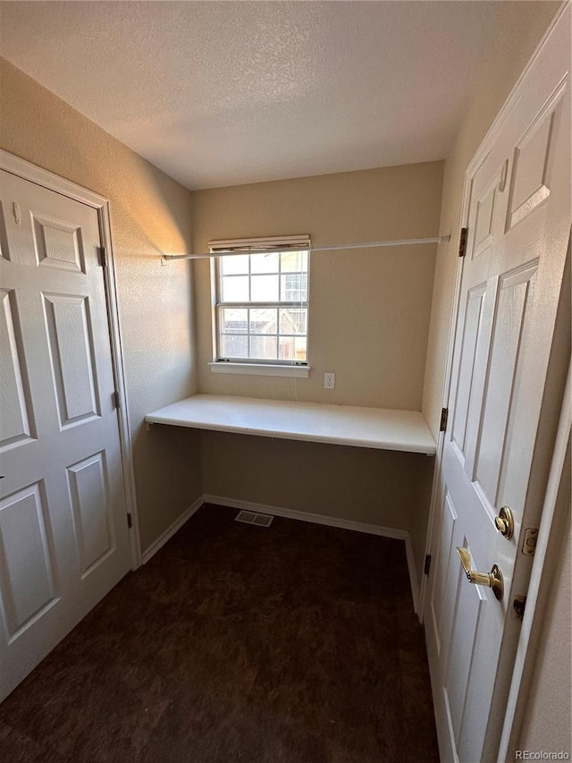 bathroom featuring a textured ceiling