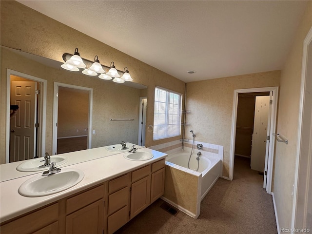 bathroom with vanity and a washtub