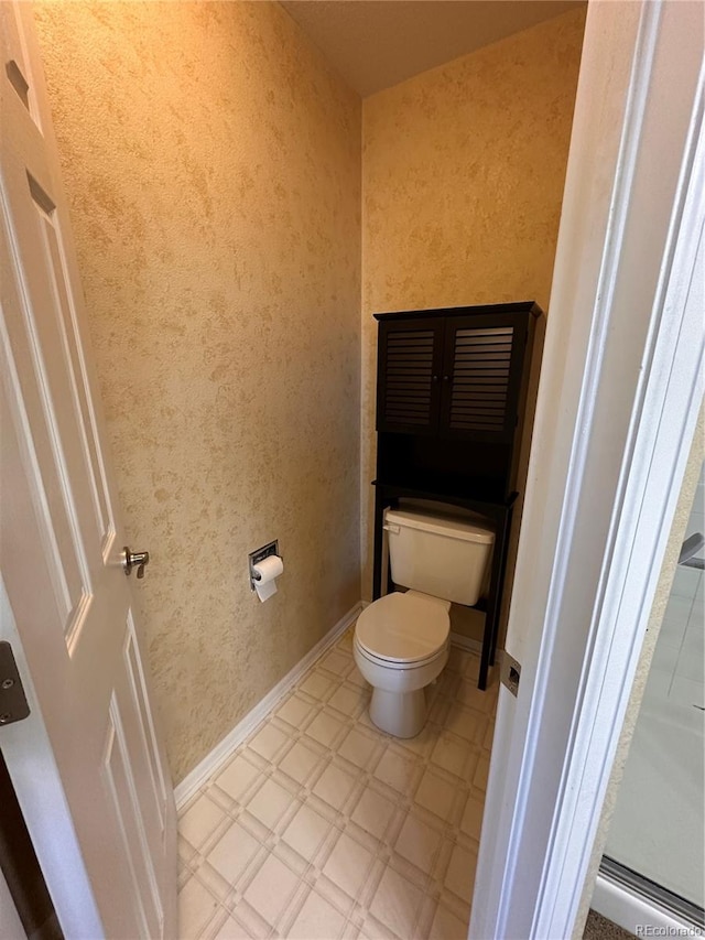 bathroom featuring toilet