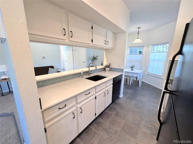 4760 S Wadsworth Blvd Unit F105, Littleton, CO 80123 - kitchen featuring a sink, dishwasher, freestanding refrigerator, light countertops, and white cabinets
