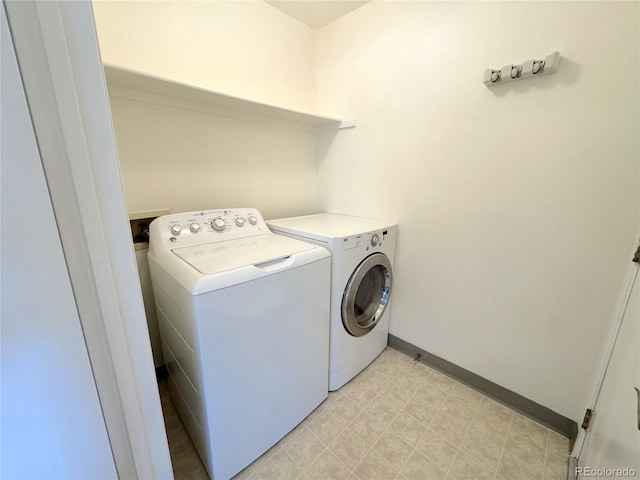 4760 S Wadsworth Blvd Unit F105, Littleton, CO 80123 - laundry room featuring independent washer and dryer and baseboards