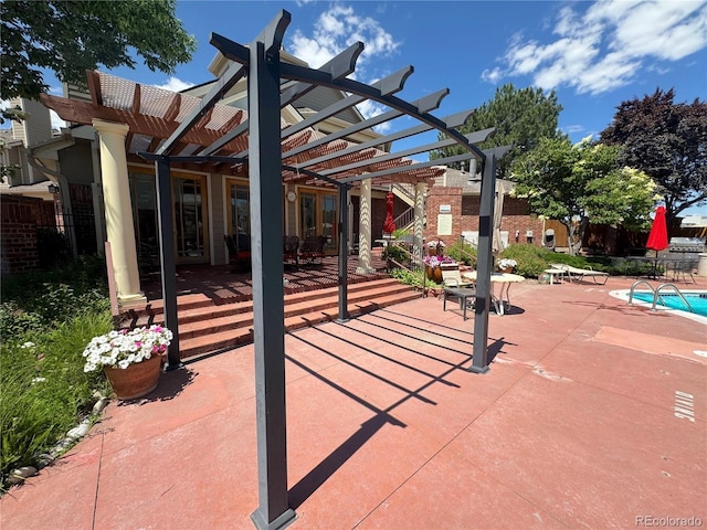 4760 S Wadsworth Blvd Unit F105, Littleton, CO 80123 - view of patio featuring a pergola and a community pool