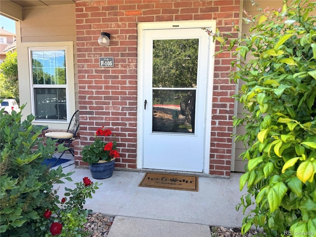 4760 S Wadsworth Blvd Unit F105, Littleton, CO 80123 - doorway to property featuring brick siding