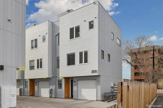 3101 W 47th Ave Unit 14, Denver, CO 80211 - view of front of home featuring an attached garage and driveway