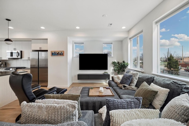 3101 W 47th Ave Unit 14, Denver, CO 80211 - living area with light wood-style floors and recessed lighting