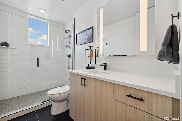 3101 W 47th Ave Unit 14, Denver, CO 80211 - bathroom with vanity, a baseboard radiator, a stall shower, and tile patterned floors