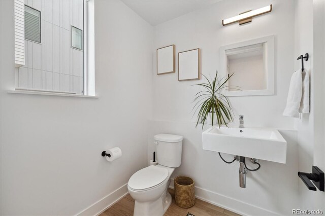 3101 W 47th Ave Unit 14, Denver, CO 80211 - half bathroom with wood finished floors