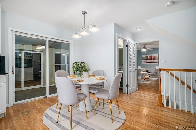 dining area featuring light hardwood / wood-style flooring and ceiling fan