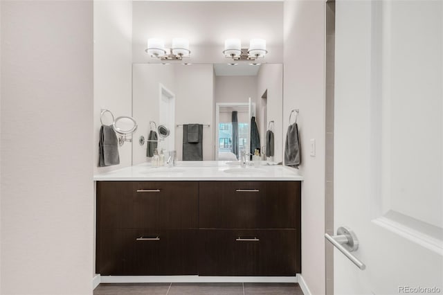 bathroom featuring double vanity and a sink