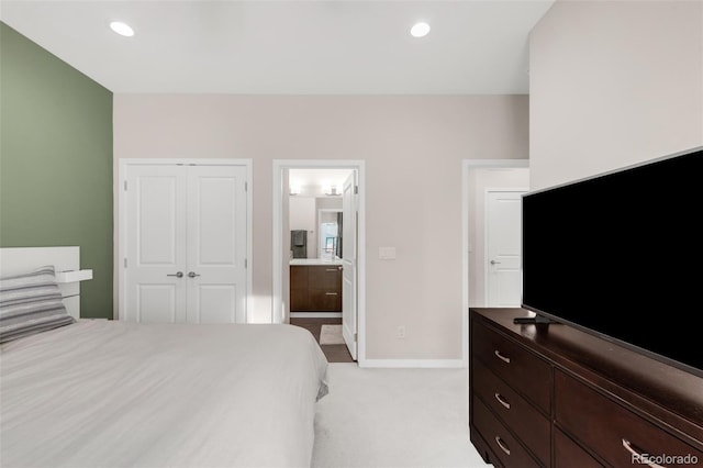 bedroom with light carpet, baseboards, a closet, and recessed lighting