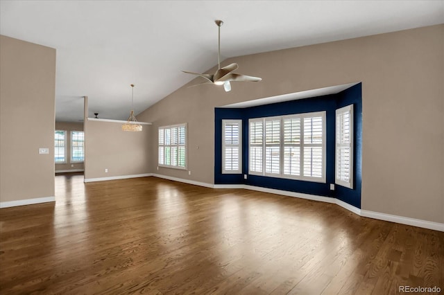 8951 Greenwich St, Highlands Ranch, CO 80130 - spare room featuring a ceiling fan, plenty of natural light, wood finished floors, and lofted ceiling