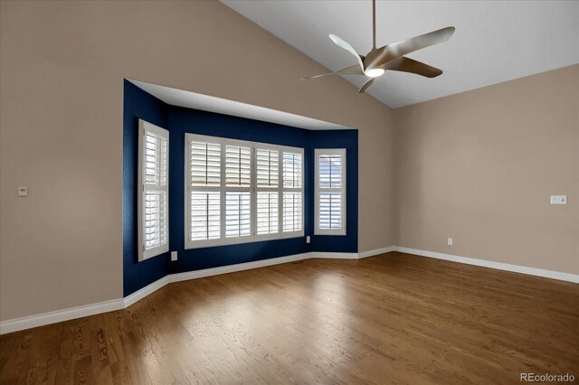8951 Greenwich St, Highlands Ranch, CO 80130 - spare room featuring a ceiling fan, wood finished floors, vaulted ceiling, and baseboards