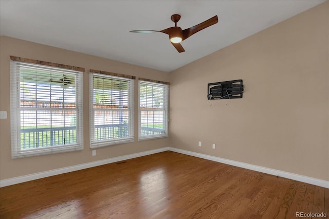 8951 Greenwich St, Highlands Ranch, CO 80130 - unfurnished room featuring wood finished floors, a ceiling fan, baseboards, and lofted ceiling