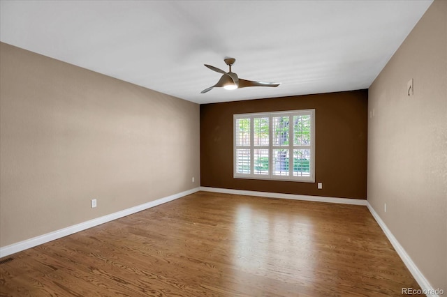 8951 Greenwich St, Highlands Ranch, CO 80130 - unfurnished room with a ceiling fan, wood finished floors, and baseboards