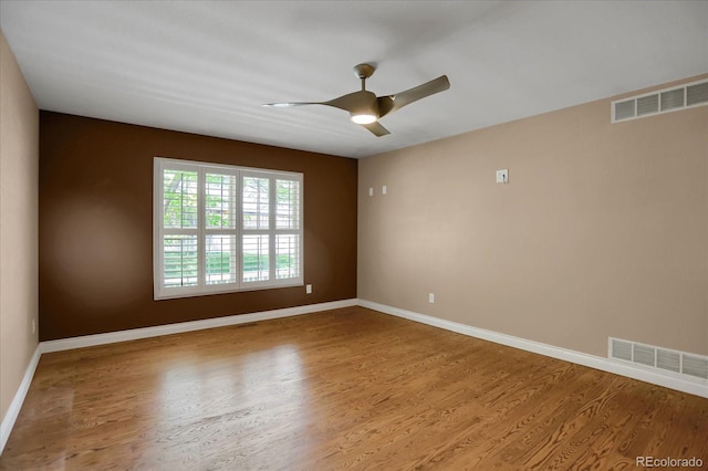 8951 Greenwich St, Highlands Ranch, CO 80130 - empty room featuring wood finished floors, a ceiling fan, and baseboards