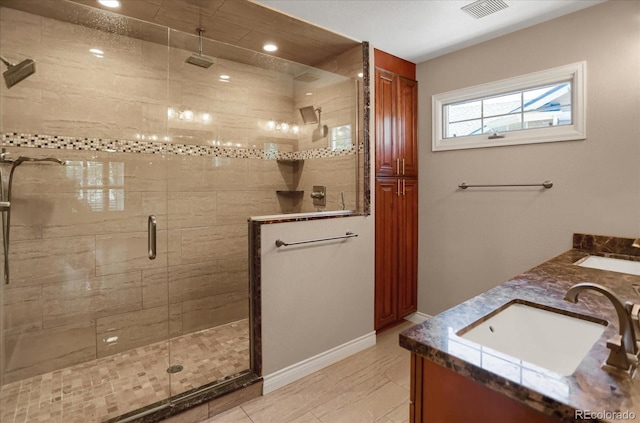8951 Greenwich St, Highlands Ranch, CO 80130 - bathroom with a stall shower, double vanity, recessed lighting, and baseboards