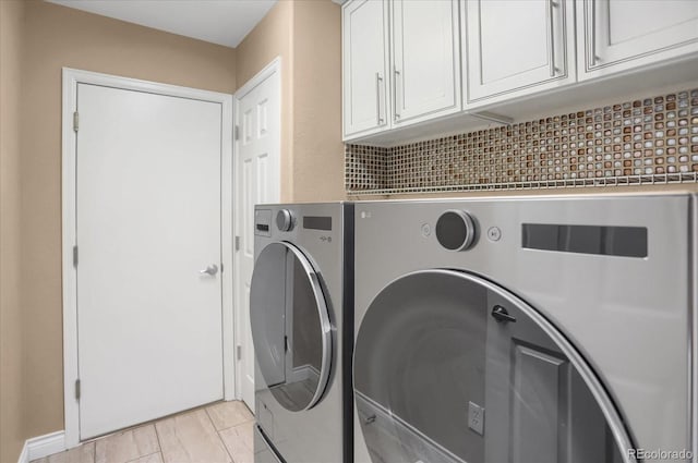 8951 Greenwich St, Highlands Ranch, CO 80130 - washroom with washer and dryer and cabinet space
