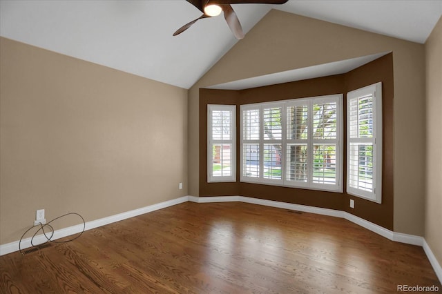 8951 Greenwich St, Highlands Ranch, CO 80130 - unfurnished room featuring a ceiling fan, wood finished floors, lofted ceiling, and baseboards