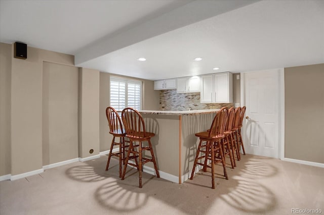8951 Greenwich St, Highlands Ranch, CO 80130 - indoor bar with light carpet, baseboards, decorative backsplash, and recessed lighting
