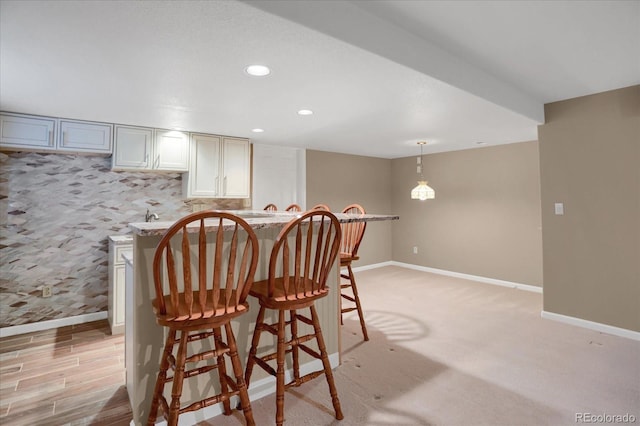 8951 Greenwich St, Highlands Ranch, CO 80130 - dining area with baseboards, recessed lighting, and light carpet
