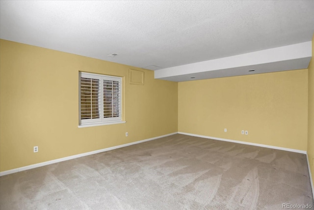 8951 Greenwich St, Highlands Ranch, CO 80130 - unfurnished room with carpet, baseboards, and a textured ceiling