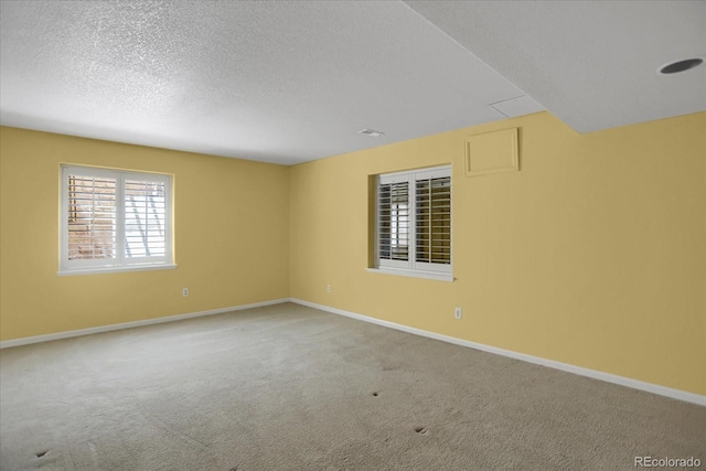 8951 Greenwich St, Highlands Ranch, CO 80130 - spare room with baseboards, carpet flooring, and a textured ceiling