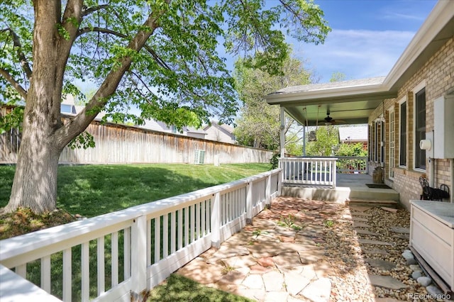 8951 Greenwich St, Highlands Ranch, CO 80130 - view of yard with ceiling fan and a porch