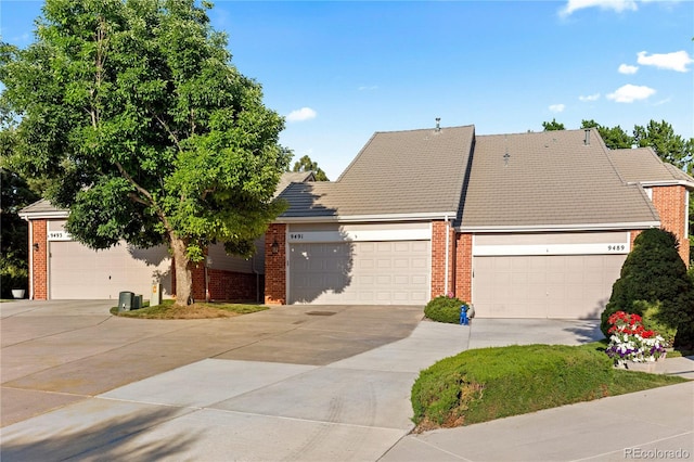 9491 Southern Hills Cir, Lone Tree, CO 80124 - view of front of home featuring brick siding, driveway, and an attached garage