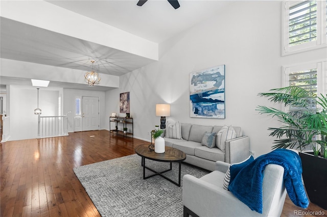 9491 Southern Hills Cir, Lone Tree, CO 80124 - living area with hardwood / wood-style floors, a ceiling fan, and a chandelier